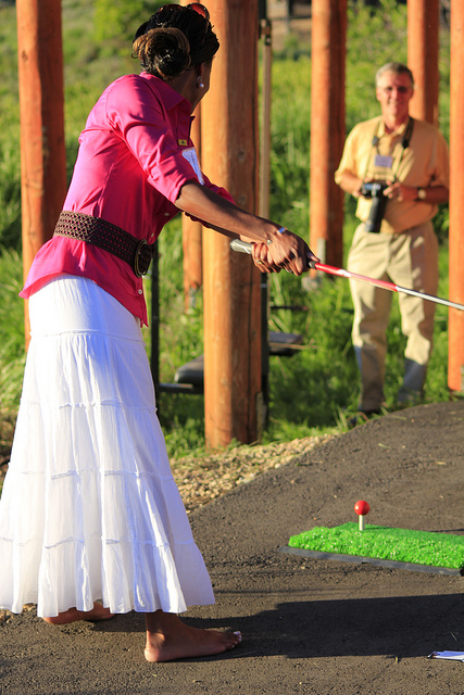Mia Love, shooting golf balls into the lake at Greg Peterson's cabin