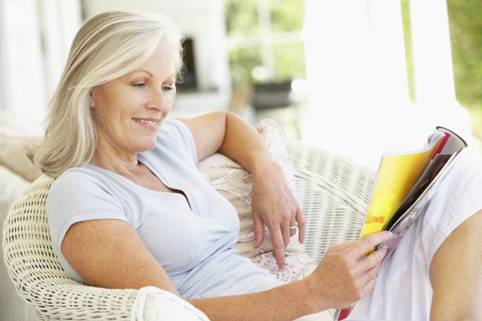 Woman reading newspaper