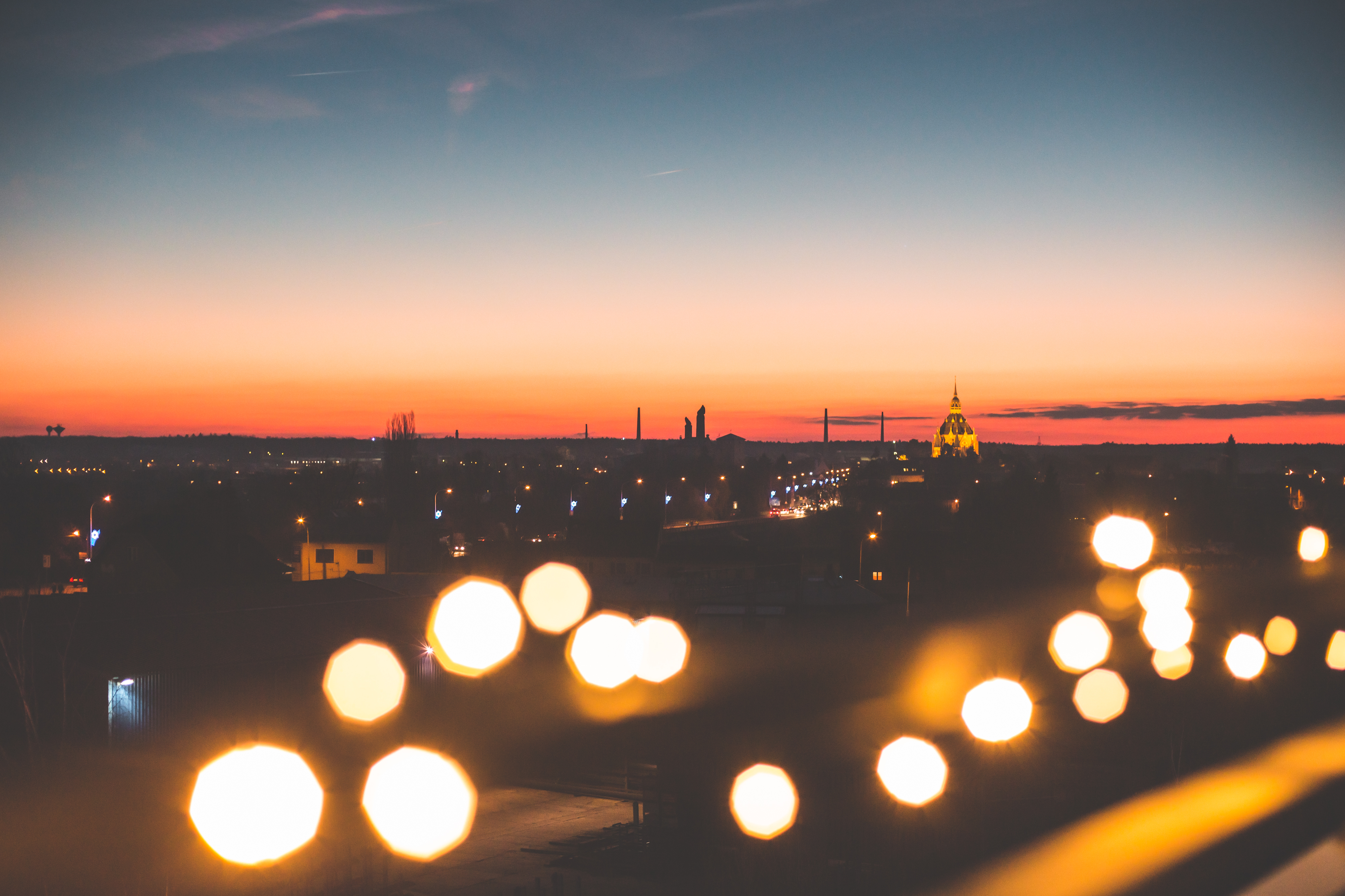 sunset-cityscape-with-bokeh-lights-picjumbo-com.jpg