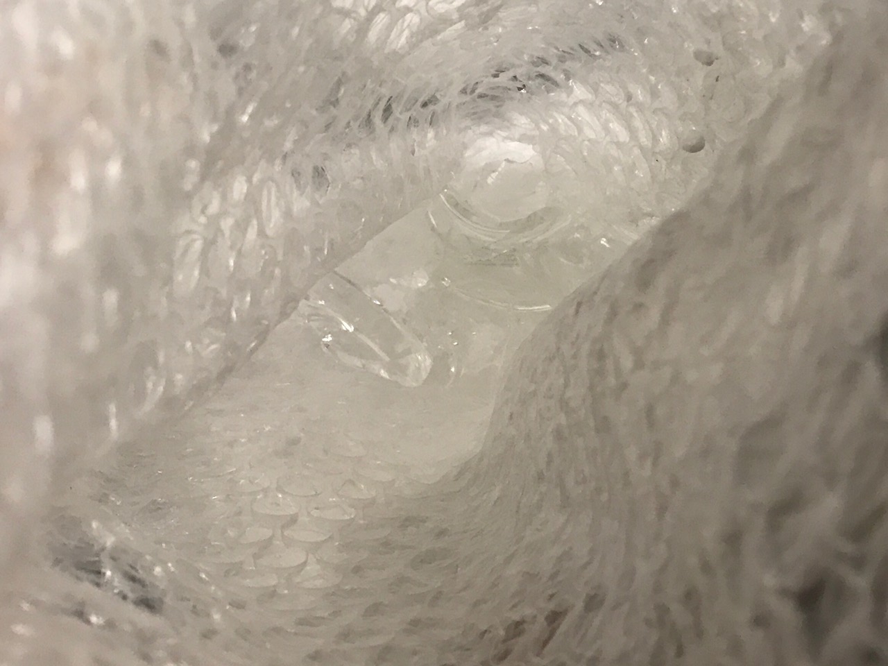 Shattered pieces at bottom of bag