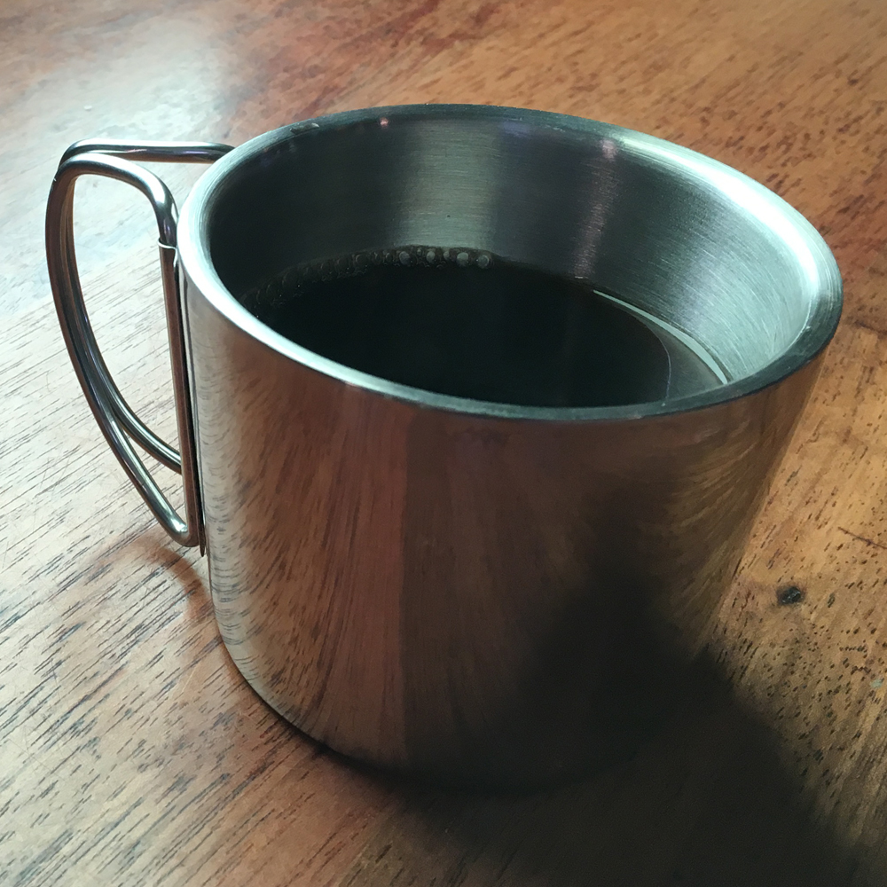 titan-gear-coffee-mug-lifestyle-wooden-table-1.jpg