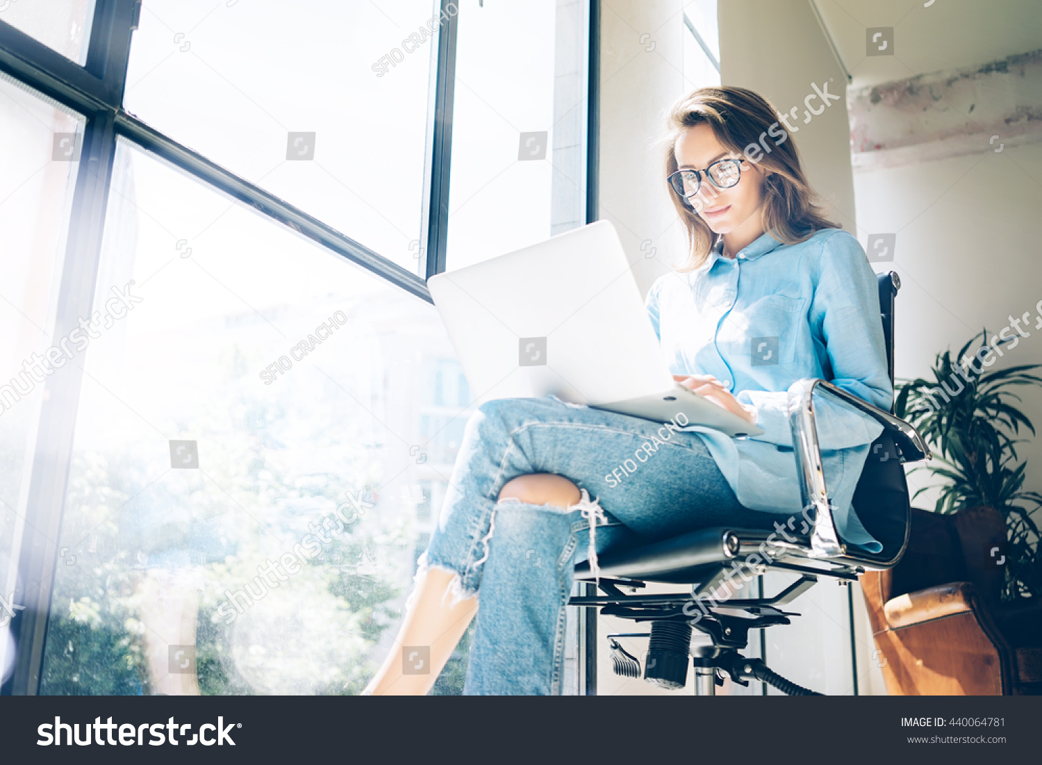 stock-photo-hipster-woman-use-laptop-huge-loft-studio-student-researching-process-work-young-business-team-440064781.jpg