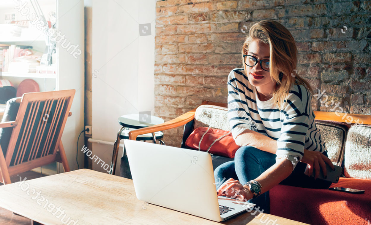 stock-photo-beautiful-young-blonde-female-student-using-portable-laptop-computer-while-sitting-in-a-vintage-418455928.jpg