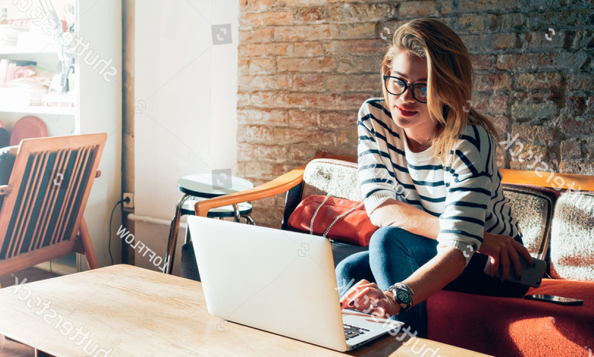 stock-photo-beautiful-young-blonde-female-student-using-portable-laptop-computer-while-sitting-in-a-vintage-418455928.jpg