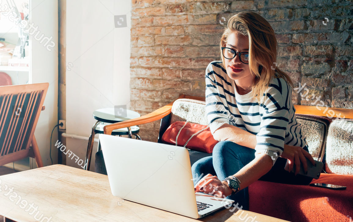 stock-photo-beautiful-young-blonde-female-student-using-portable-laptop-computer-while-sitting-in-a-vintage-418455928.jpg