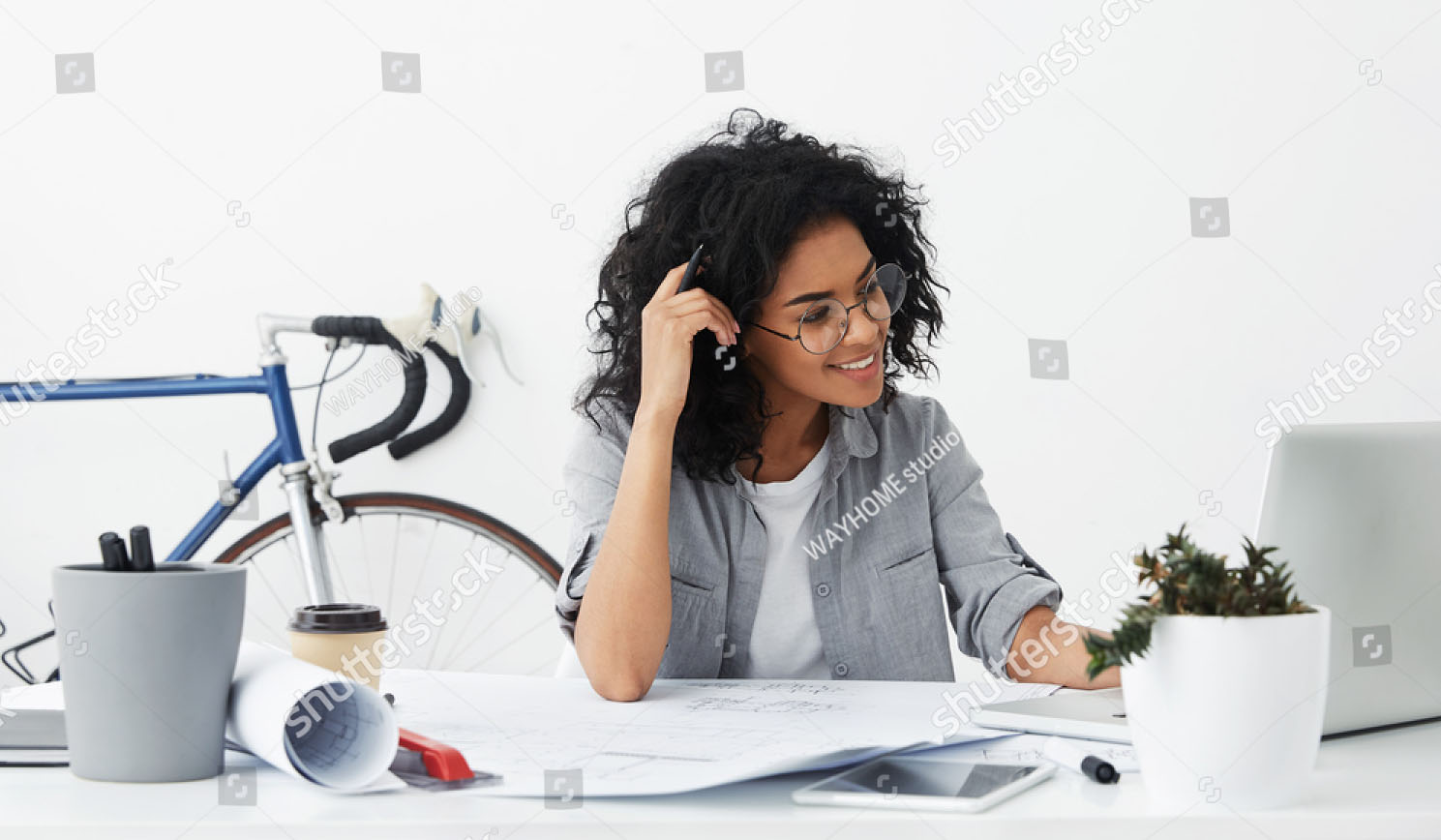 stock-photo-positive-young-beautiful-american-woman-wearing-stylish-shirt-and-big-round-glasses-making-drawings-644572378.jpg