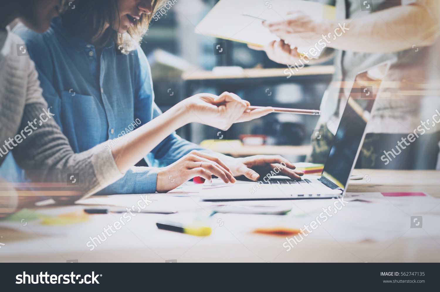 stock-photo-teamwork-brainstorming-concept-young-creative-managers-team-working-with-new-startup-project-in-562747135.jpg