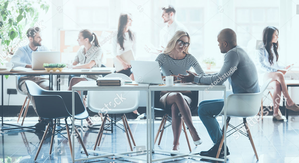 stock-photo-work-in-action-group-of-young-business-people-working-and-communicating-with-each-other-while-439220971.jpg