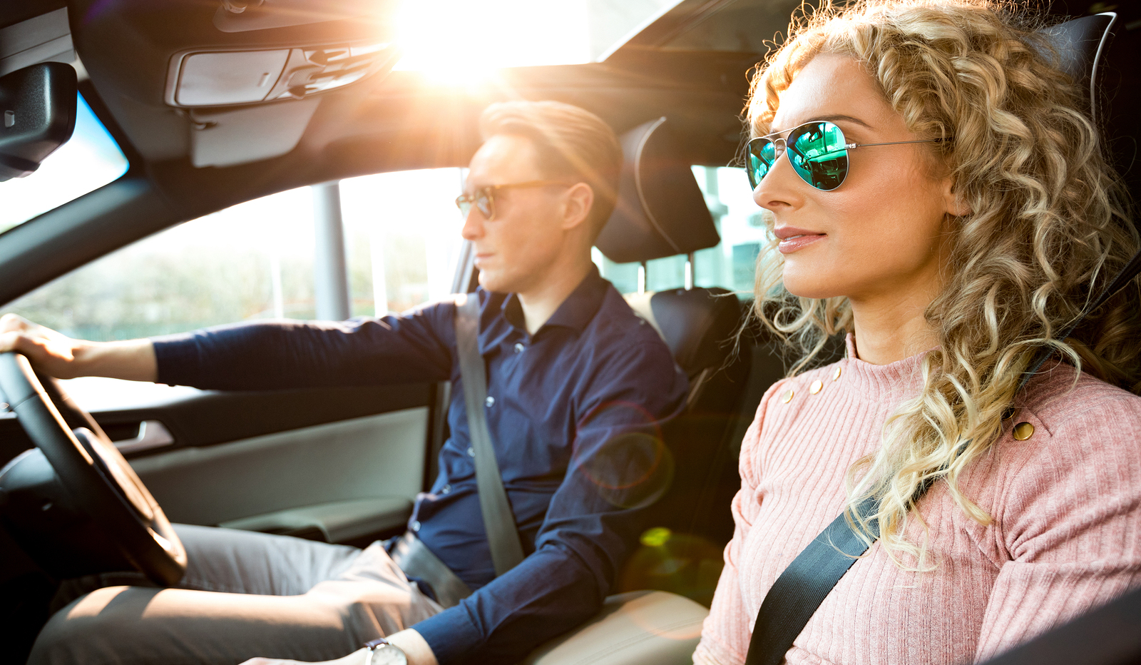 bigstock-Couple-driving-car-during-test-193630249.jpg