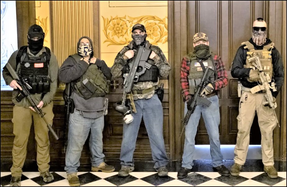Armed-militia-group-stands-in-front-of-governors-office-to-protest-shutdowns-in-Michigan_-Photo-source-Seth-Herald_Reuters.jpg